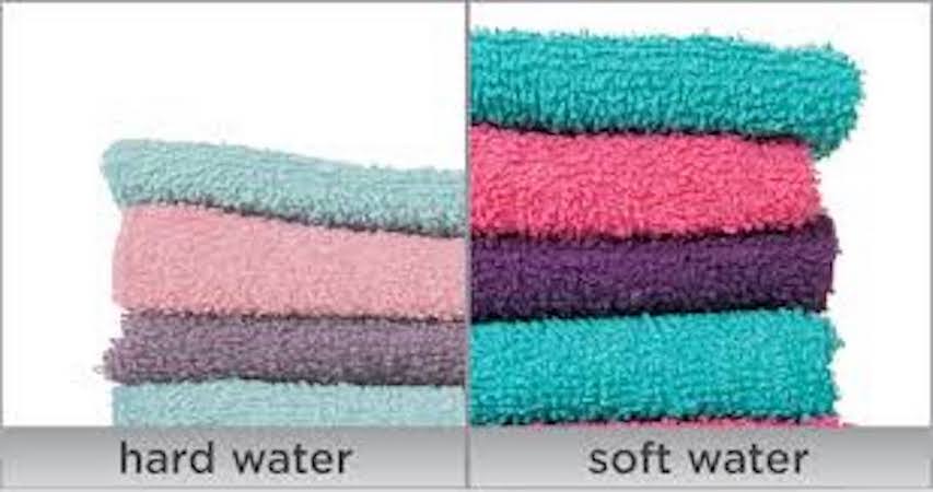 Towels that show color fading caused by washing in hard water vs bright clean towels washed in soft water(2).jpeg